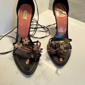 Vintage Prada black stiletto heals with pink floral detail and black laces.